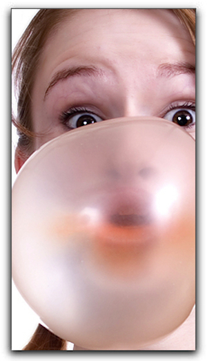 A girl blowing balloon