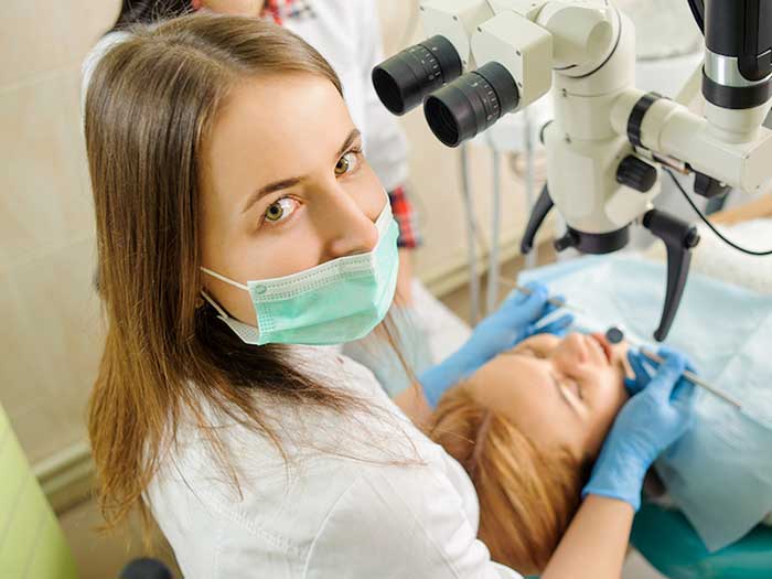 Dentist treating the patient