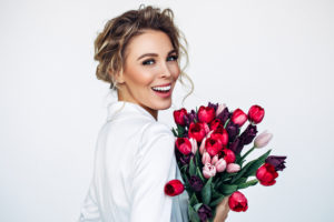 A girl holding flowers in her hand